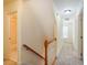 Bright hallway with carpeted floors and stairs, leading to other parts of the house at 507 Vatersay Dr, Apex, NC 27502