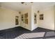 Inviting outdoor porch featuring a dark wood floor and ample natural light at 507 Vatersay Dr, Apex, NC 27502