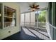 Enclosed porch, complete with ceiling fan, offers an airy extension of living space at 507 Vatersay Dr, Apex, NC 27502