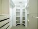 Spacious walk-in closet featuring custom shelving and storage units at 507 Vatersay Dr, Apex, NC 27502