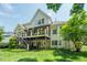 Multi-story home with a deck, stairs, and ample backyard space at 671 Bear Tree Crk, Chapel Hill, NC 27517