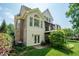 View of the home's back exterior, showcasing the deck and lush landscaping at 671 Bear Tree Crk, Chapel Hill, NC 27517