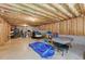 Unfinished basement offering space to add your personal touches, with exposed wood beams and a concrete floor at 671 Bear Tree Crk, Chapel Hill, NC 27517