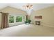 Spacious bedroom with large windows, vaulted ceiling, and neutral decor at 671 Bear Tree Crk, Chapel Hill, NC 27517