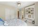 Bedroom featuring a built-in desk, shelving and two closets in the background at 671 Bear Tree Crk, Chapel Hill, NC 27517