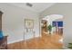 Inviting foyer with hardwood floors, arched doorways, elegant console table, and views of the staircase at 671 Bear Tree Crk, Chapel Hill, NC 27517