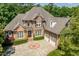 Traditional brick home with a two-car garage, landscaped yard and circular driveway at 671 Bear Tree Crk, Chapel Hill, NC 27517