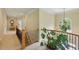 Elegant hallway with decorative molding, wood banister staircase and large window at 671 Bear Tree Crk, Chapel Hill, NC 27517