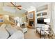 Bright living room with fireplace, built-in shelving and cream-colored furniture at 671 Bear Tree Crk, Chapel Hill, NC 27517