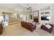 Open living room featuring a fireplace, built-ins, high ceilings, and staircase at 671 Bear Tree Crk, Chapel Hill, NC 27517