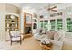 Bright living room with fireplace, built-in shelving and cream-colored furniture at 671 Bear Tree Crk, Chapel Hill, NC 27517