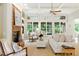 Bright living room with fireplace, built-in shelving and cream-colored furniture at 671 Bear Tree Crk, Chapel Hill, NC 27517