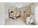 A four-poster bed is the highlight of this Main Bedroom, which includes a built-in cabinet and chair at 671 Bear Tree Crk, Chapel Hill, NC 27517