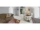 A pleasant sitting area has a patterned chair and couch with a window to bring in natural light at 671 Bear Tree Crk, Chapel Hill, NC 27517