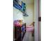 Organized closet with shelving, storage bench, and space for personal items at 6916 Morrow Mill Road, Chapel Hill, NC 27516