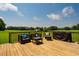 An inviting deck featuring outdoor furniture and a beautiful view of the surrounding landscape at 6916 Morrow Mill Road, Chapel Hill, NC 27516