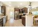 Modern kitchen featuring granite countertops, stainless steel appliances, hardwood floors, and ample natural light at 6916 Morrow Mill Road, Chapel Hill, NC 27516