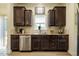A kitchen featuring granite countertops, stainless steel appliances, and hardwood flooring at 6916 Morrow Mill Road, Chapel Hill, NC 27516