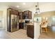 A modern kitchen features granite countertops, stainless steel appliances and hardwood flooring at 6916 Morrow Mill Road, Chapel Hill, NC 27516