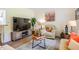 Cozy living room featuring a TV, comfortable seating, and stylish decor, creating a relaxing atmosphere at 6916 Morrow Mill Road, Chapel Hill, NC 27516