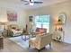 Bright and cozy living room with neutral furniture, decorative accents, and ample natural light at 6916 Morrow Mill Road, Chapel Hill, NC 27516