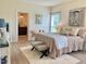 A main bedroom featuring decor, a bedroom set, and an entrance to the main bathroom at 6916 Morrow Mill Road, Chapel Hill, NC 27516