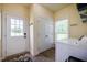 Mud room with washer, dryer, and exterior door at 6916 Morrow Mill Road, Chapel Hill, NC 27516