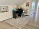 This bright office features modern workstation, a neutral rug and artwork at 6916 Morrow Mill Road, Chapel Hill, NC 27516