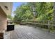 Relaxing back deck, surrounded by lush trees, offering a private outdoor retreat at 712 Beaver Dam Rd, Raleigh, NC 27607