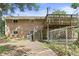 Brick house exterior featuring a deck, stairs, and fenced yard, offering outdoor space at 712 Beaver Dam Rd, Raleigh, NC 27607