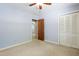 Spacious bedroom featuring natural light, a closet, and a view into an adjacent room at 712 Beaver Dam Rd, Raleigh, NC 27607