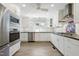 Modern kitchen with stainless steel appliances, white cabinets, and subway tile backsplash at 712 Beaver Dam Rd, Raleigh, NC 27607