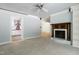 Spacious living area with a fireplace, built-ins, and a view into the kitchen at 712 Beaver Dam Rd, Raleigh, NC 27607