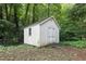 Outdoor shed in a lush, green backyard, providing ample storage space at 712 Beaver Dam Rd, Raleigh, NC 27607