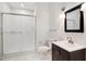 Modern bathroom featuring a sleek vanity, toilet, and glass-enclosed shower at 7309 New Forest Ln, Wake Forest, NC 27587
