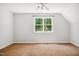 Well-lit bedroom with carpet, and a view to the exterior at 7309 New Forest Ln, Wake Forest, NC 27587
