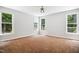 Bedroom with natural light and brown carpet at 7309 New Forest Ln, Wake Forest, NC 27587