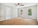 Bedroom with two windows, neutral paint and carpet at 7309 New Forest Ln, Wake Forest, NC 27587