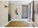 Bonus room featuring hardwood floors, storage rack, cleaning supplies rack and a window at 7309 New Forest Ln, Wake Forest, NC 27587