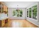 Bright dining area with natural light and wood floors, next to built-in storage at 7309 New Forest Ln, Wake Forest, NC 27587
