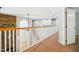 Hallway with natural light, access to multiple rooms and beautiful railing at 7309 New Forest Ln, Wake Forest, NC 27587