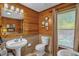 Bathroom featuring custom wood trim, marble floors, tub and shower, nice decor and furnishings at 771 Cedar Grove Church Rd, Roxboro, NC 27574