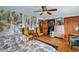 Bright bedroom featuring a forest mural, hardwood floors, and closet, perfect for relaxing at 771 Cedar Grove Church Rd, Roxboro, NC 27574