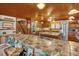 Open kitchen with a tiled backsplash, wooden ceiling and stainless steel appliances at 771 Cedar Grove Church Rd, Roxboro, NC 27574
