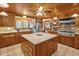 Spacious kitchen with center island, wooden cabinets, and modern appliances at 771 Cedar Grove Church Rd, Roxboro, NC 27574