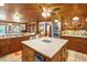 Spacious kitchen with wood ceilings, central island, custom cabinets and modern, stainless steel appliances at 771 Cedar Grove Church Rd, Roxboro, NC 27574