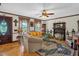 Inviting living room with a fireplace, comfortable seating, and lots of natural light at 771 Cedar Grove Church Rd, Roxboro, NC 27574