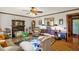 Cozy living room features a wooden fireplace, plush seating, and elegant decor at 771 Cedar Grove Church Rd, Roxboro, NC 27574