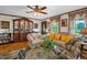 Bright living room with a glass coffee table, comfortable seating, and a built-in display cabinet at 771 Cedar Grove Church Rd, Roxboro, NC 27574