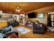 Comfortable living room featuring a wood ceiling, hardwood floors and custom decor at 771 Cedar Grove Church Rd, Roxboro, NC 27574